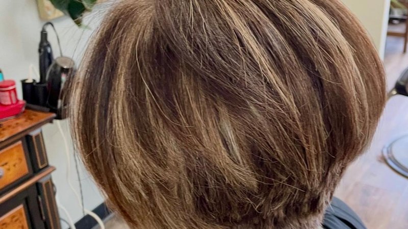 A precision short layered bob cut at Entourage Salon
