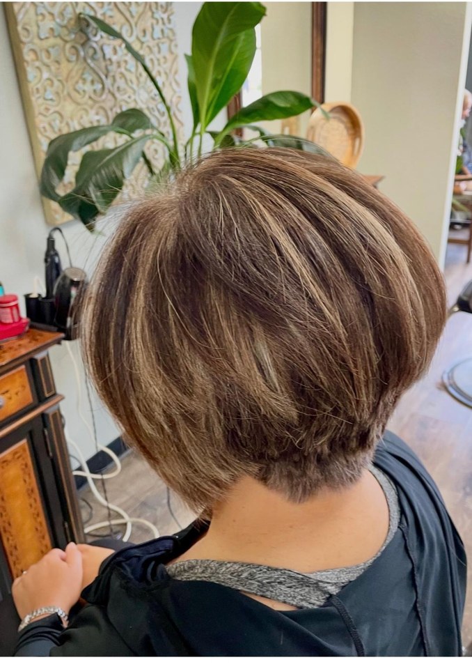 A precision short layered bob cut at Entourage Salon