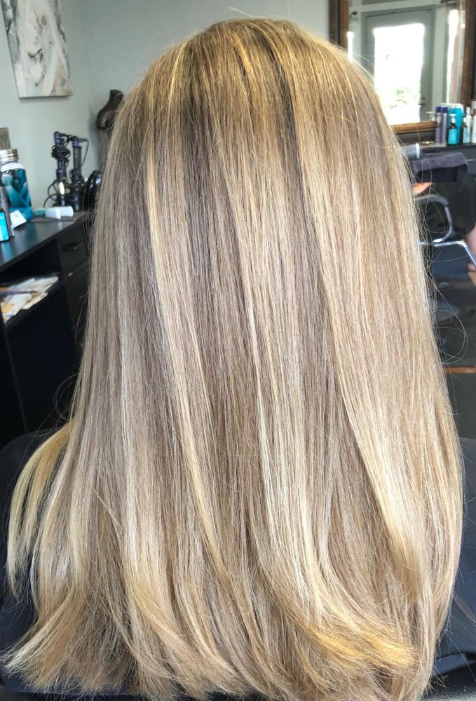 Dimensional blonde color and highlights styled at Entourage Salon